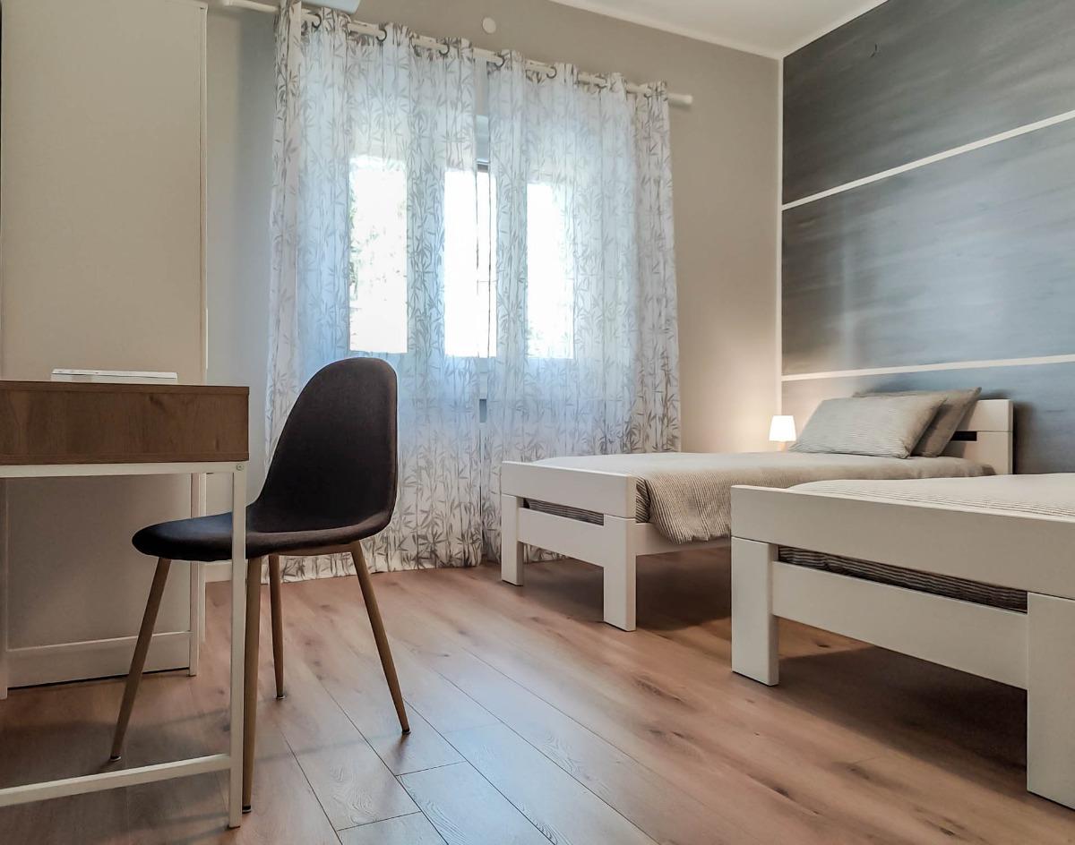 doppia letti singoli bagno privato fuori dalla camera