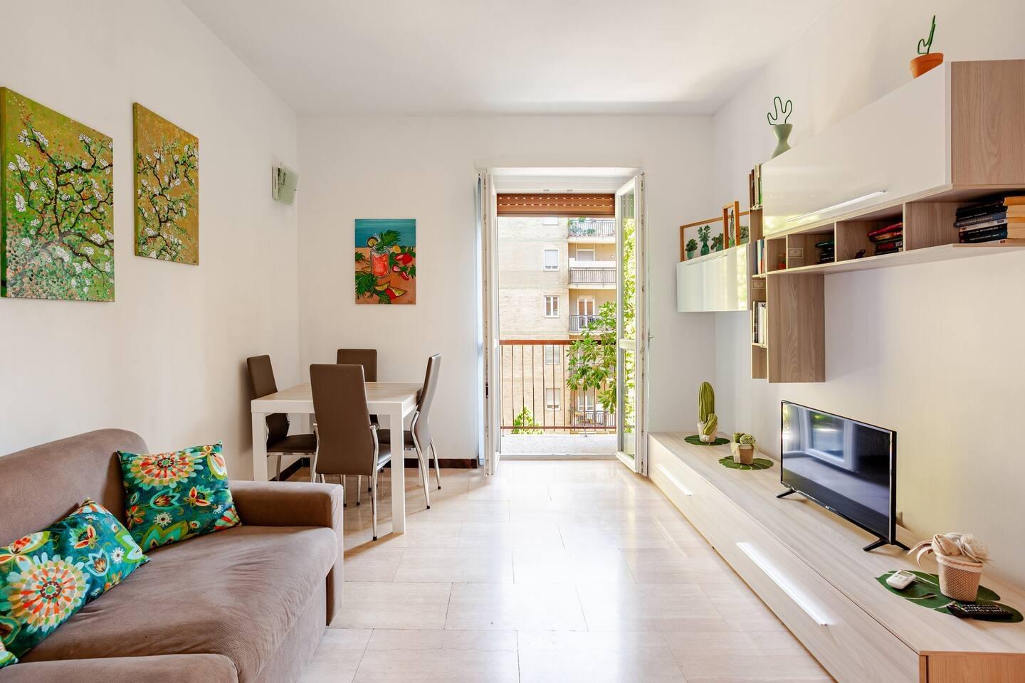sala living con divani letto e tv