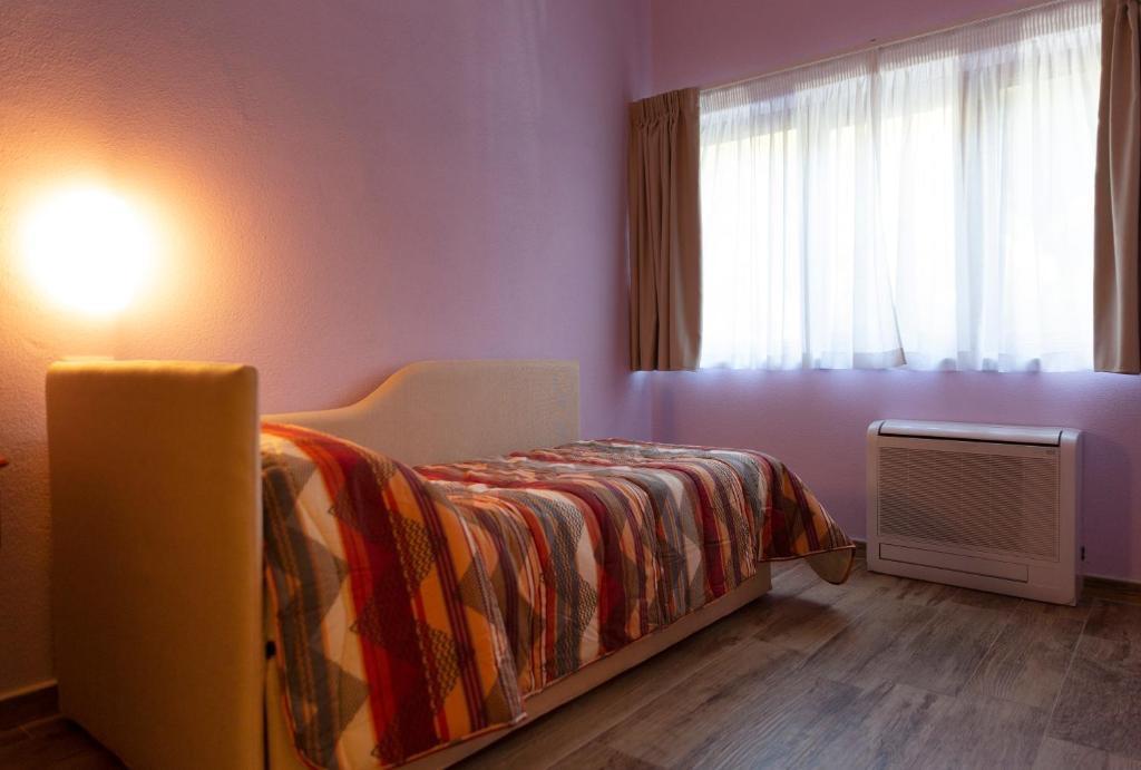 Camera con letto singolo e possibilità di aggiungere un altro letto singolo, ideale per 2 persone che dormono separate o che dormono insieme