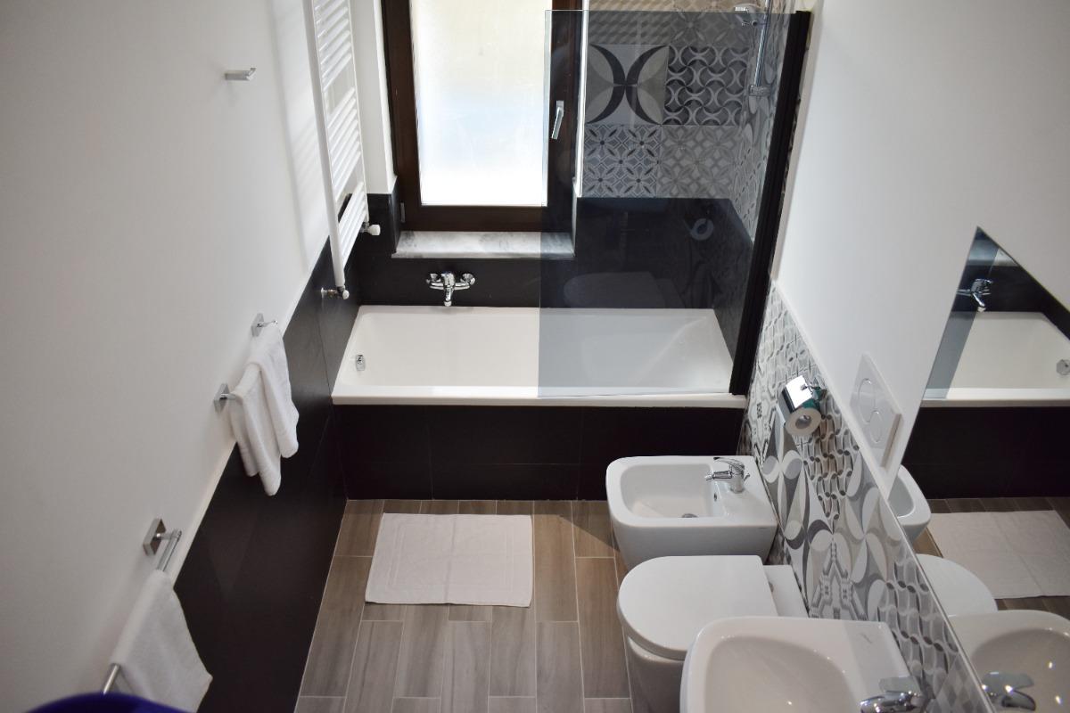 Bedroom 1 large bathroom with bath, artistic, spacious, clean