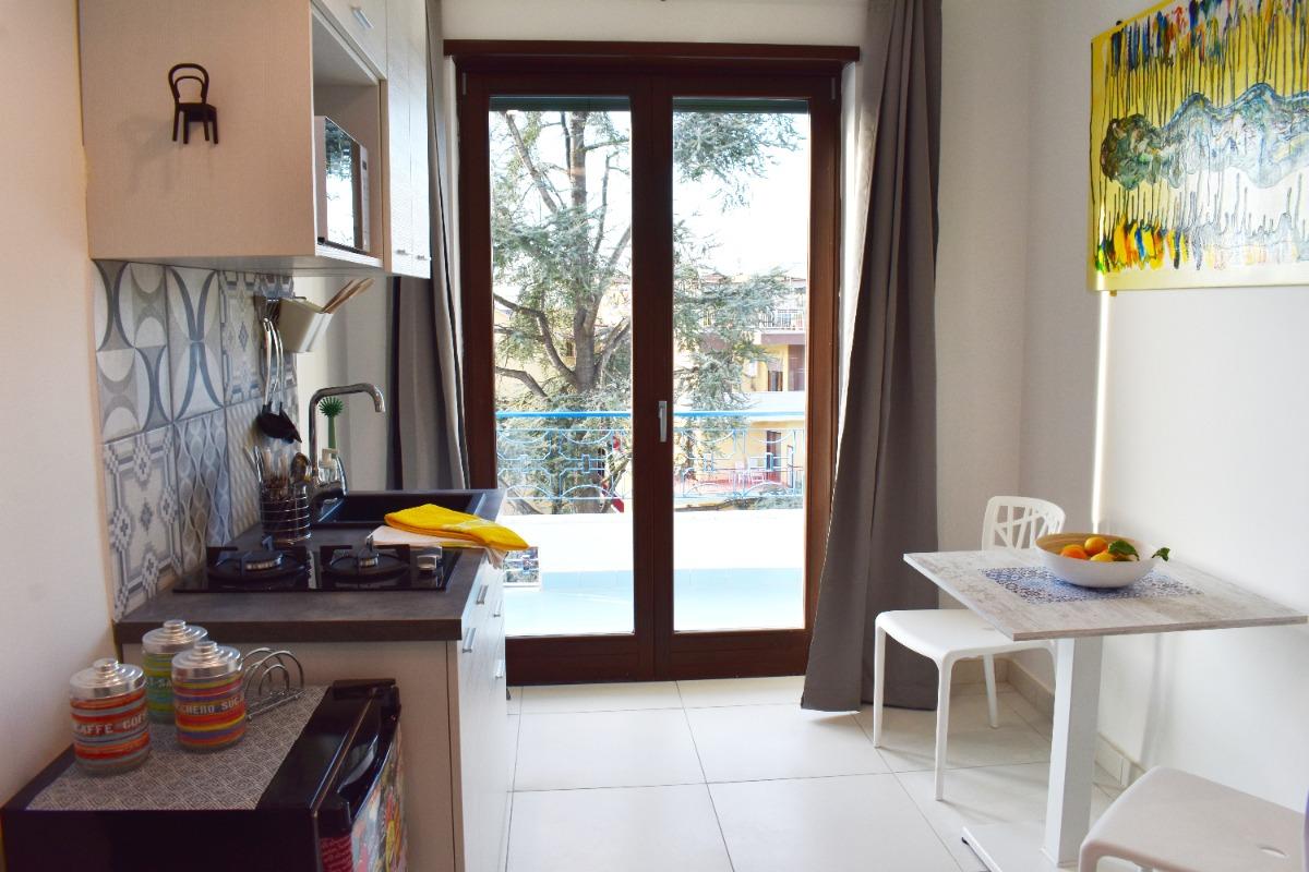 Bedroom 1 kitchen area, equipped, bright, artistic.