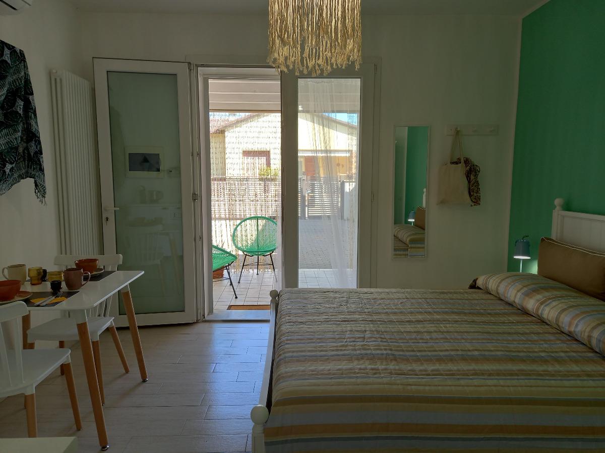 camera da letto e vista patio