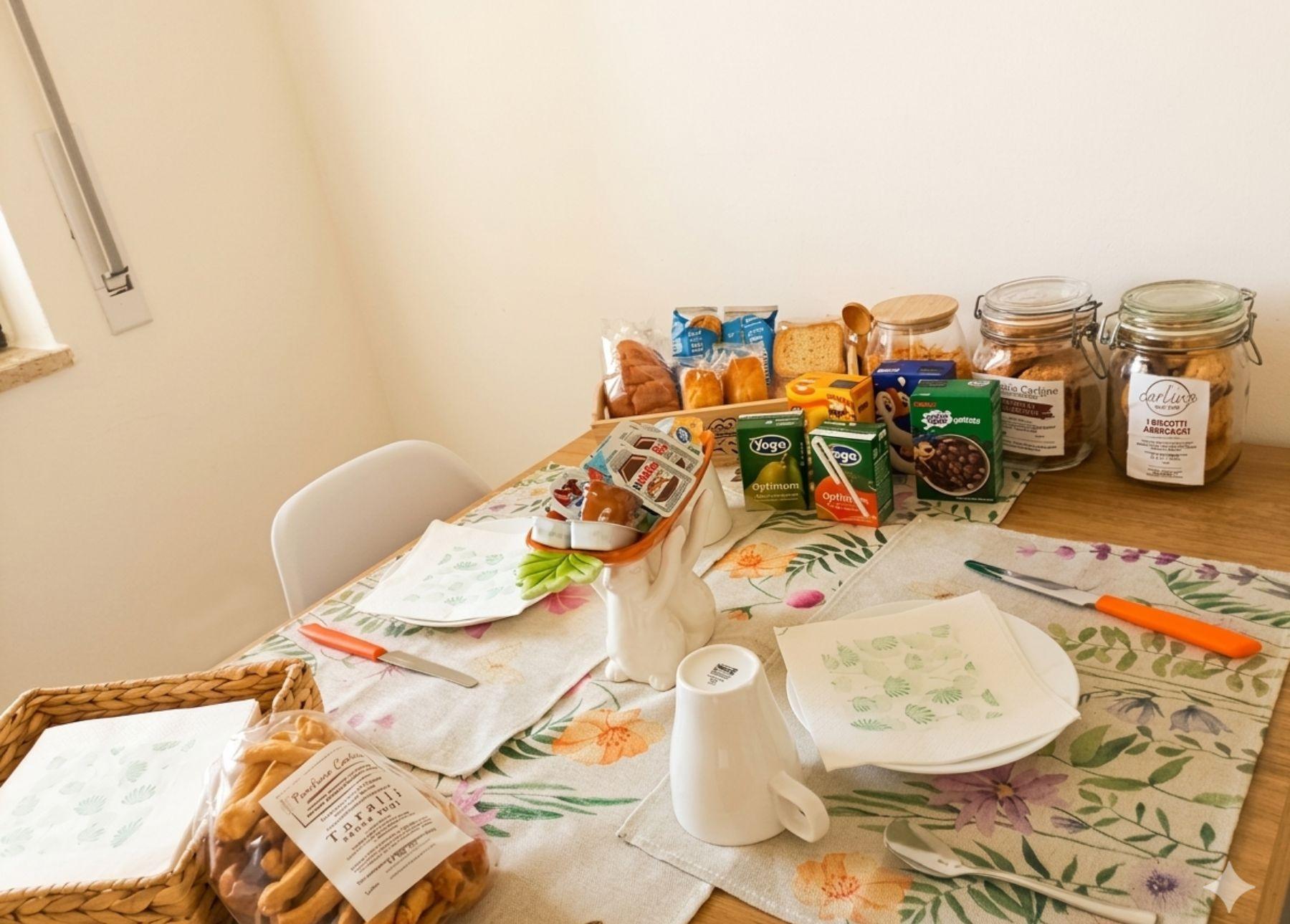Sapori di Puglia. Colazione ricca a La Casa di Beppe e Madia a Bisceglie: taralli tipici e prodotti locali per un risveglio autentico e gustoso.