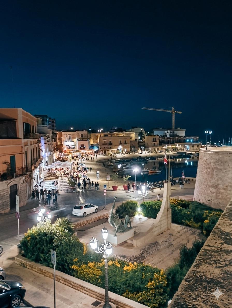 Il Porto di Bisceglie di notte. Un'atmosfera magica a pochi passi da La Casa di Beppe e Madia. Scopri il cuore della movida