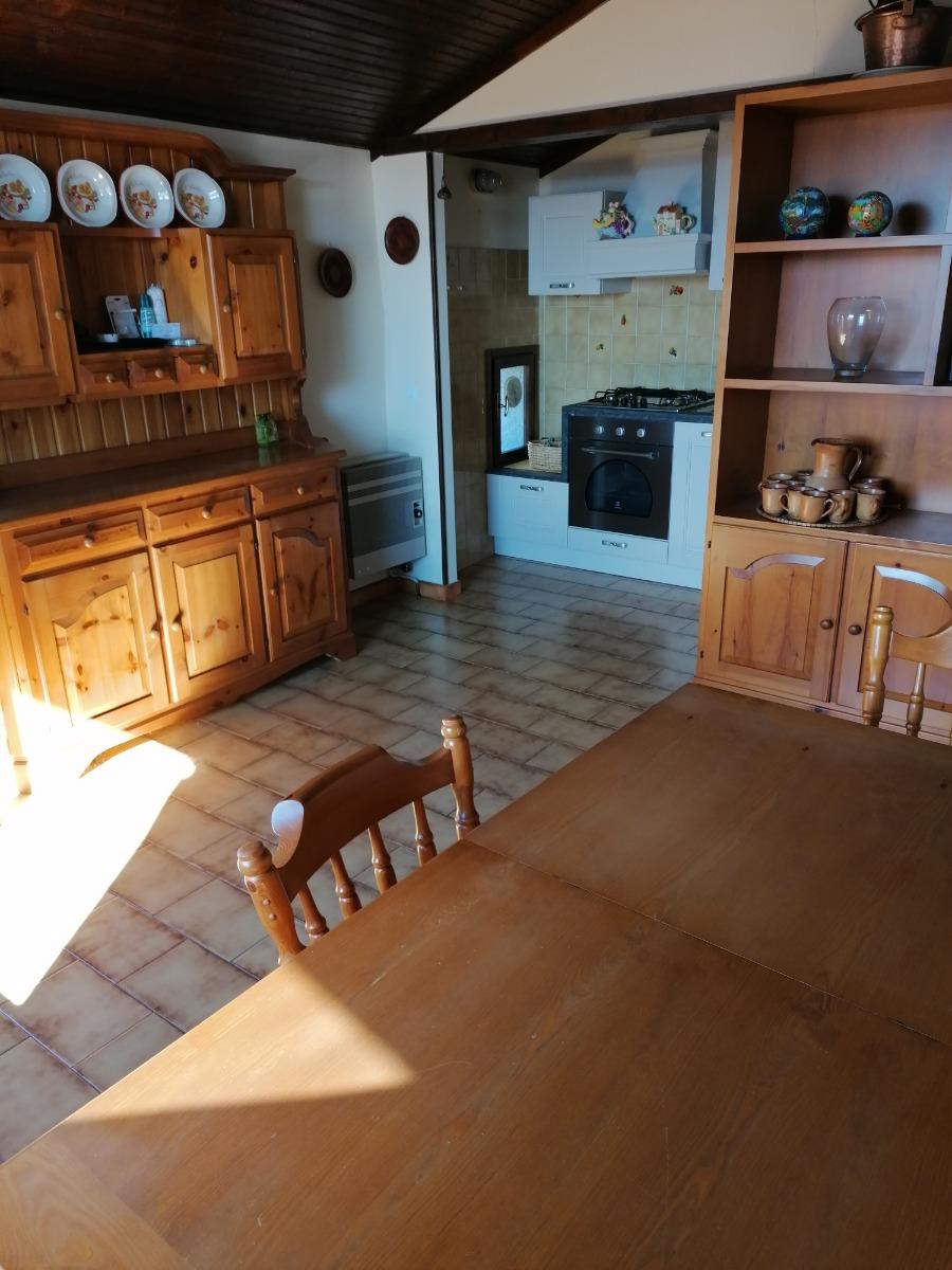 Sala da pranzo con cucina