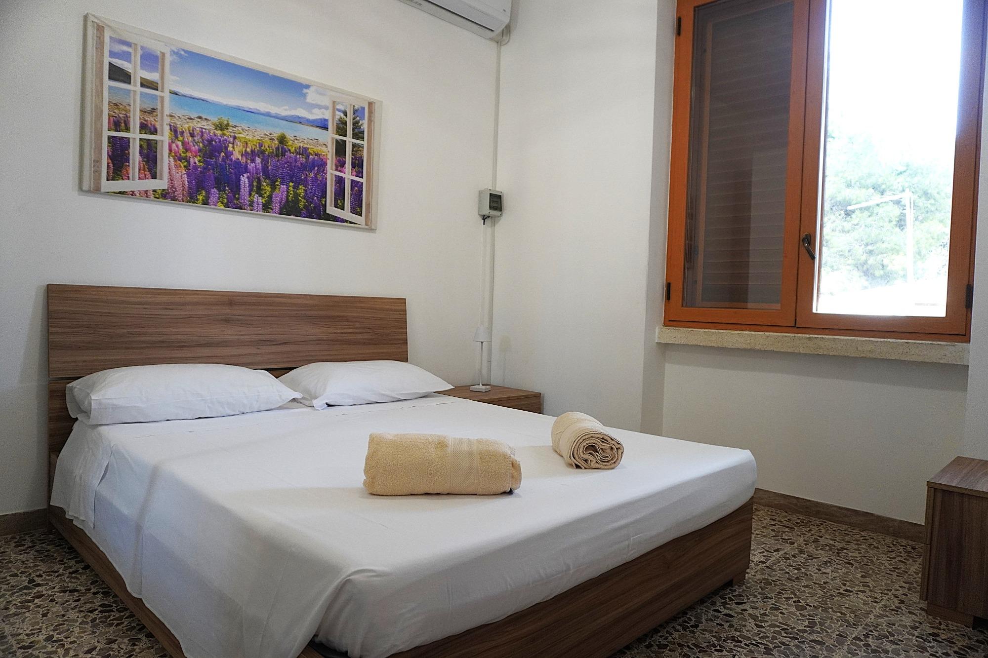Villa Ofelia a Chiatona - camera da letto appartamento Girasole
