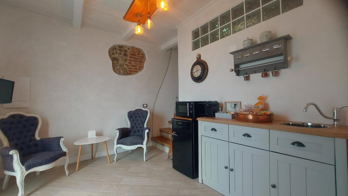 zona soggiorno e cucina camera Andromeda