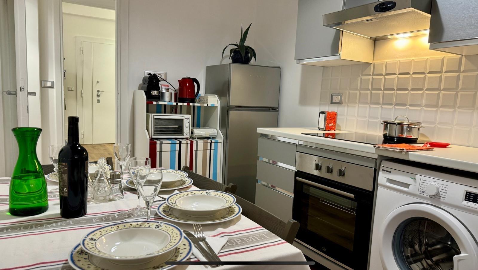 Fully equipped kitchen with dishwasher and washing machine