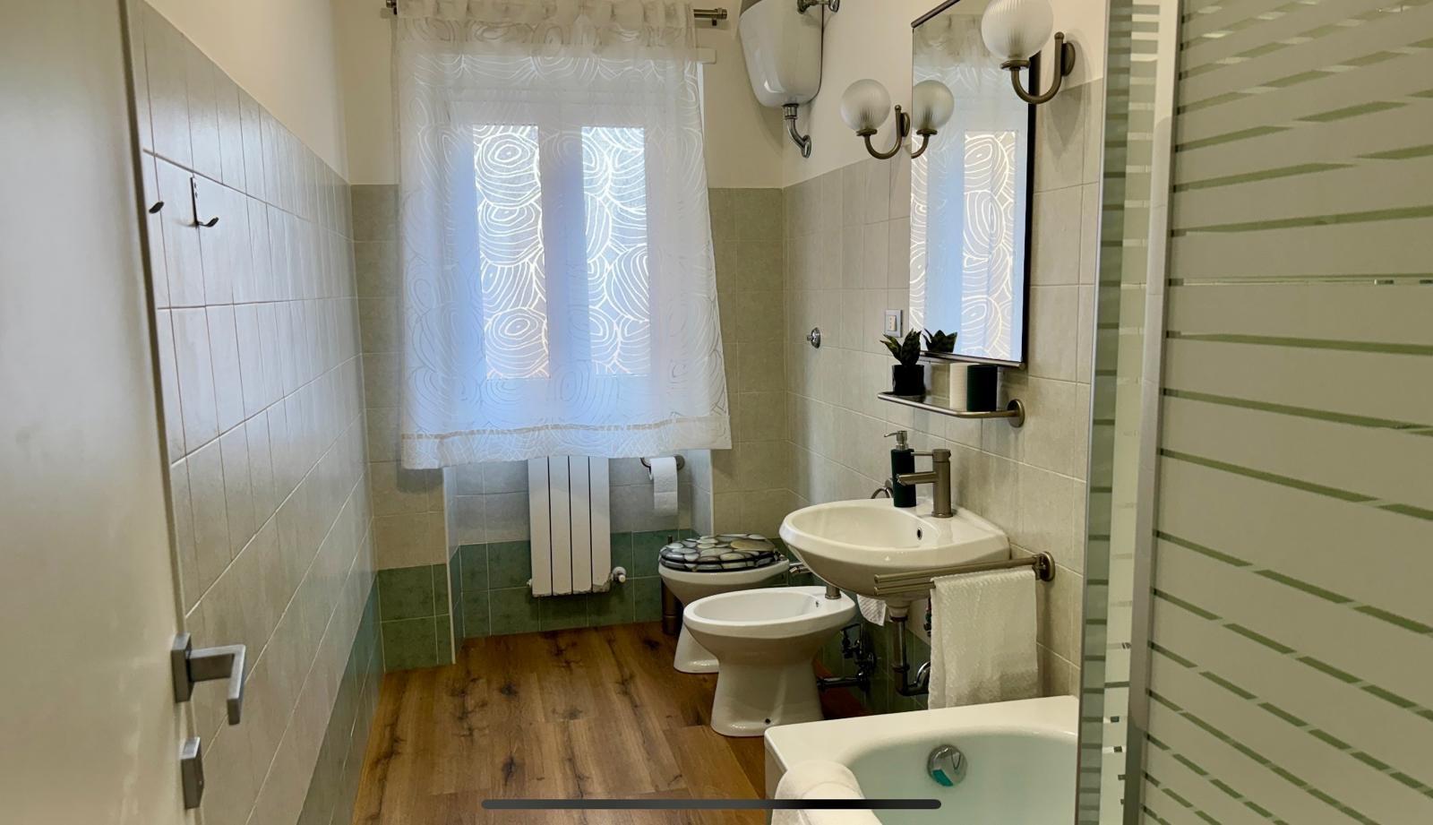 Bathroom with shower and bathtub