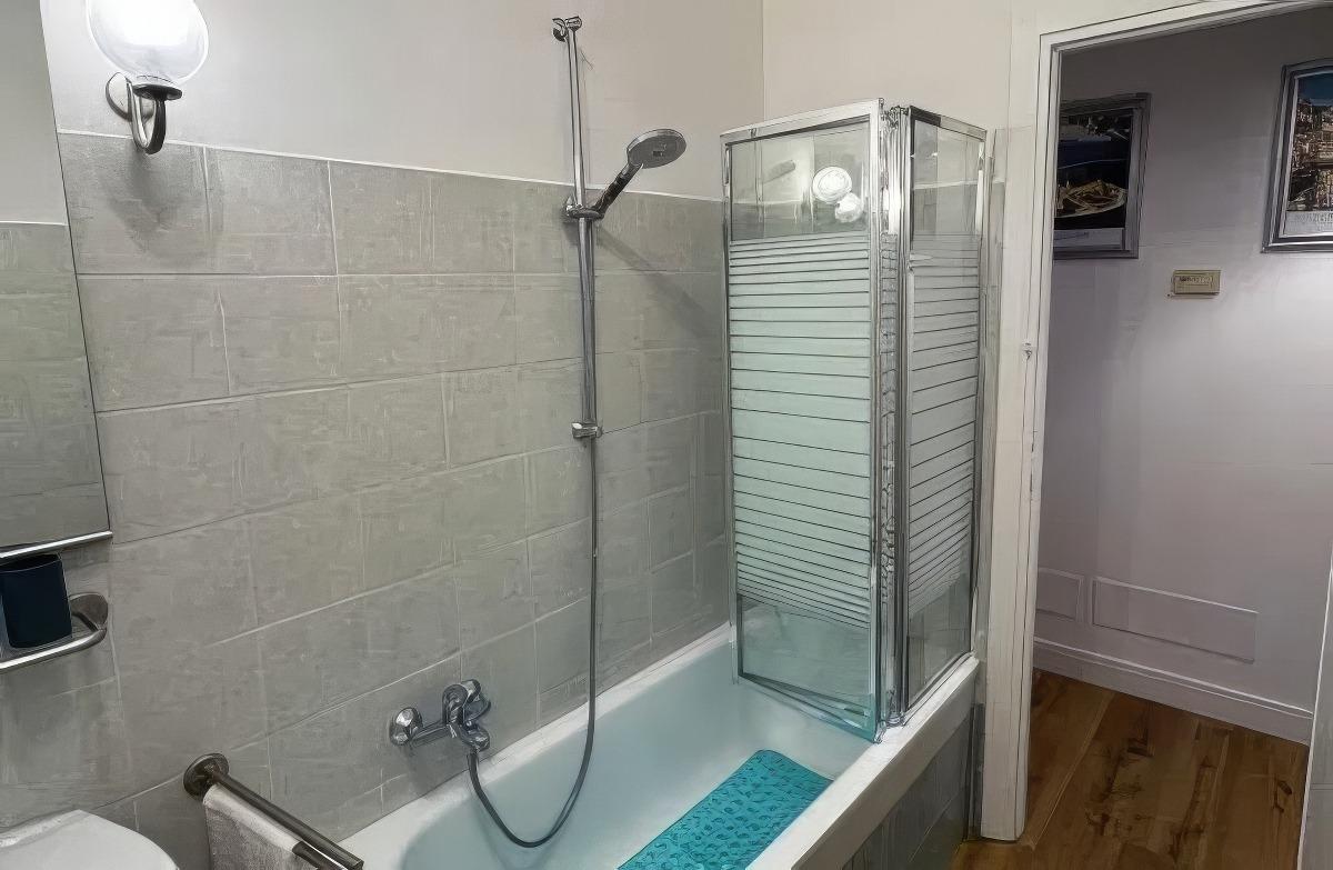 Bathroom with shower and bathtub