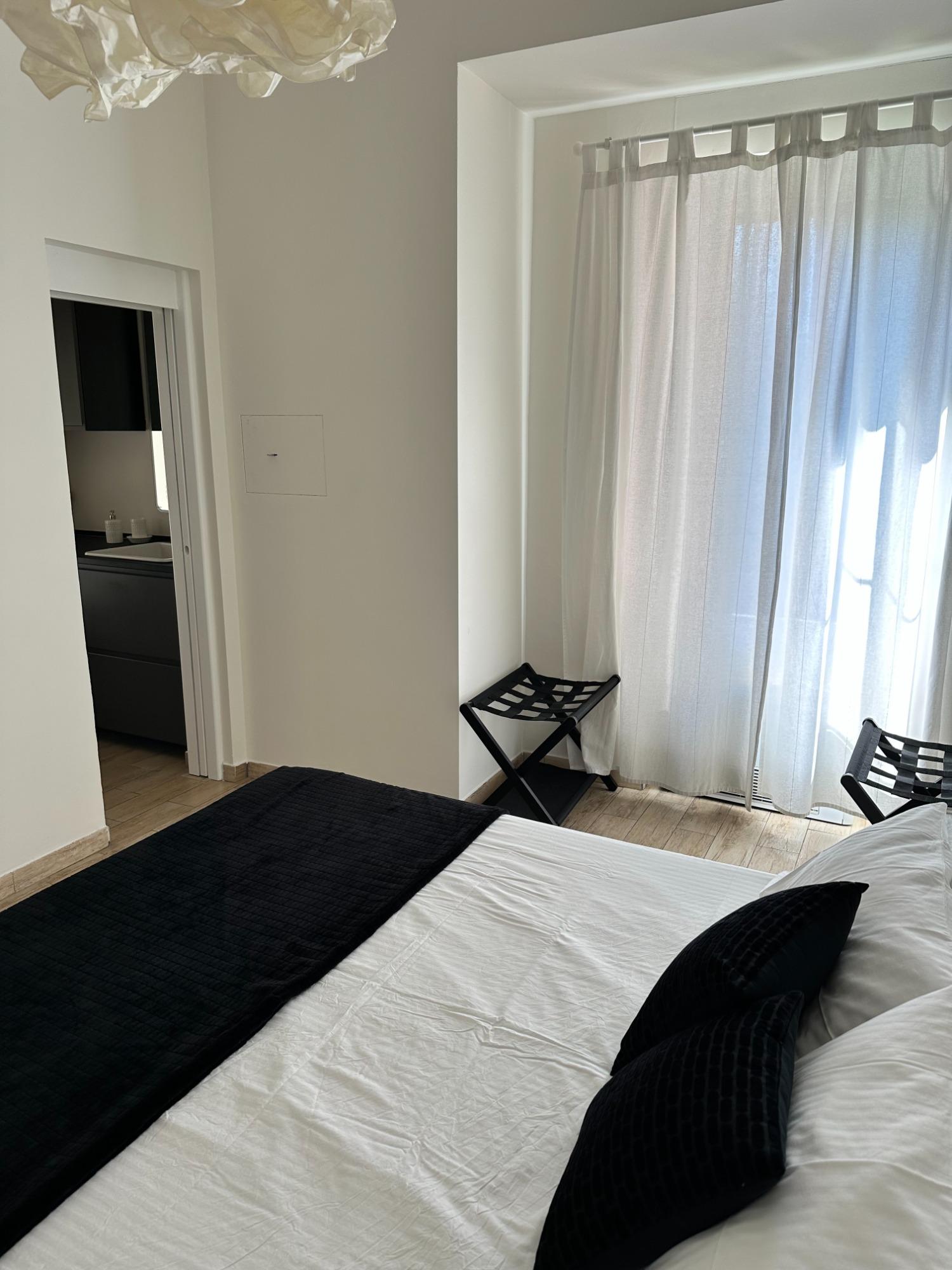 Camera matrimoniale con bagno en suite