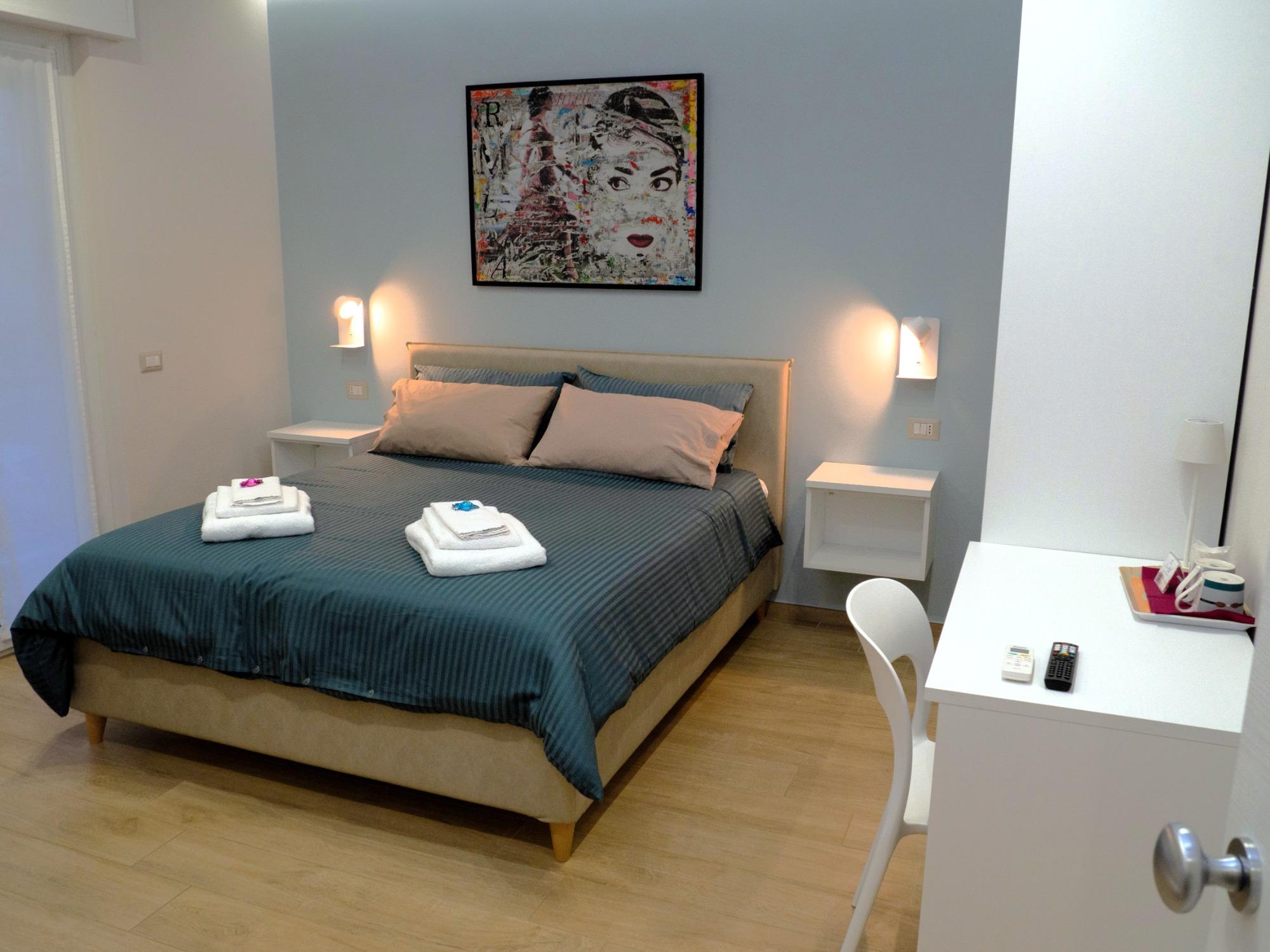 Bright and spacious Sogno room with double bed and two single beds