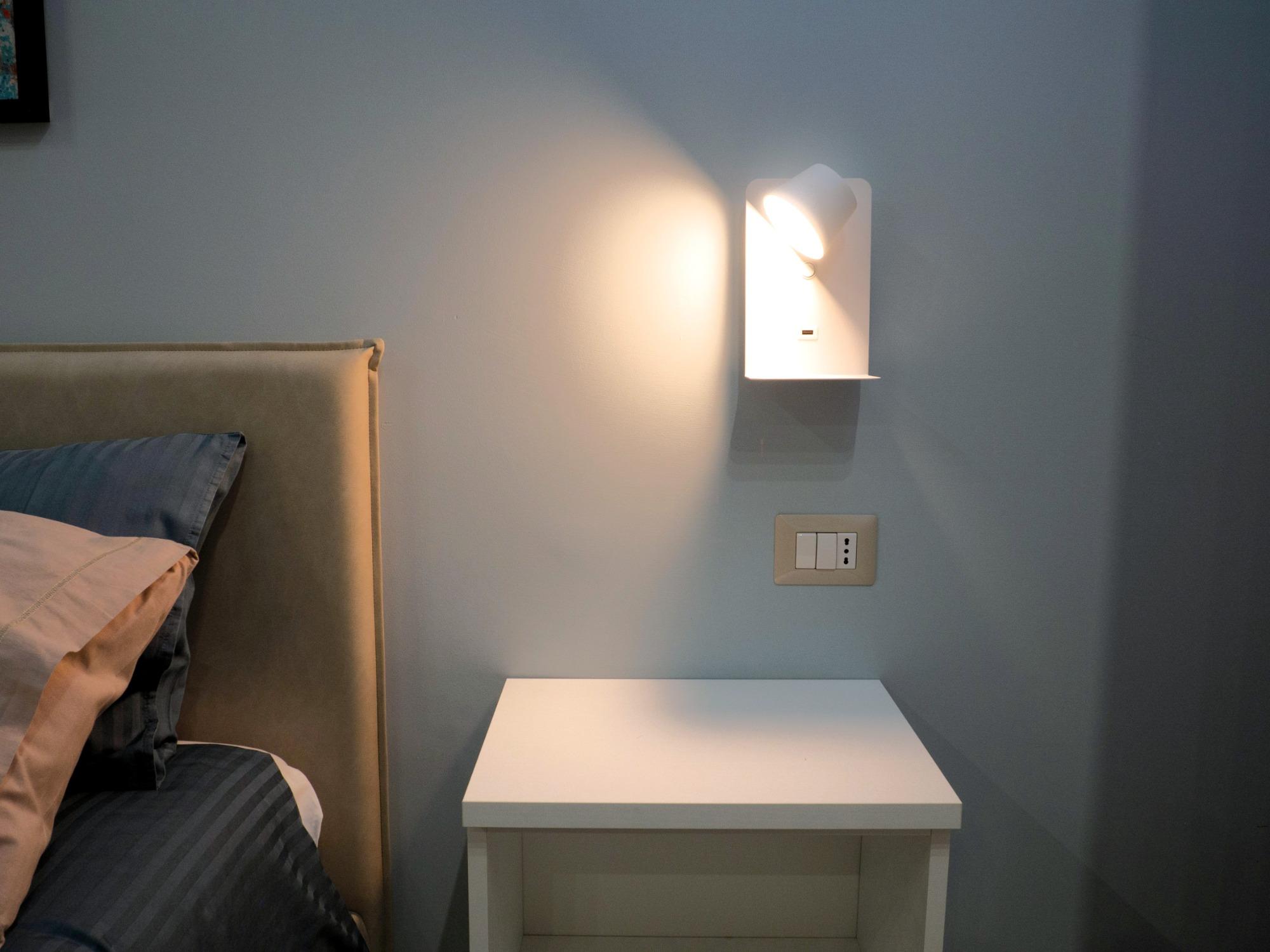 Detail of bedside lamp with USB socket in Sogno room