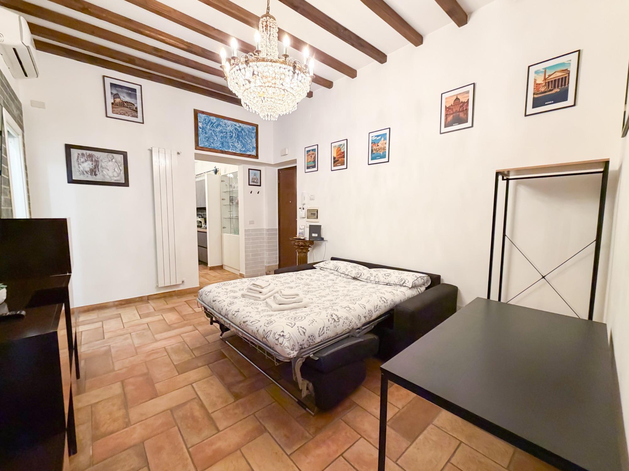 Soggiorno con divano letto matrimoniale