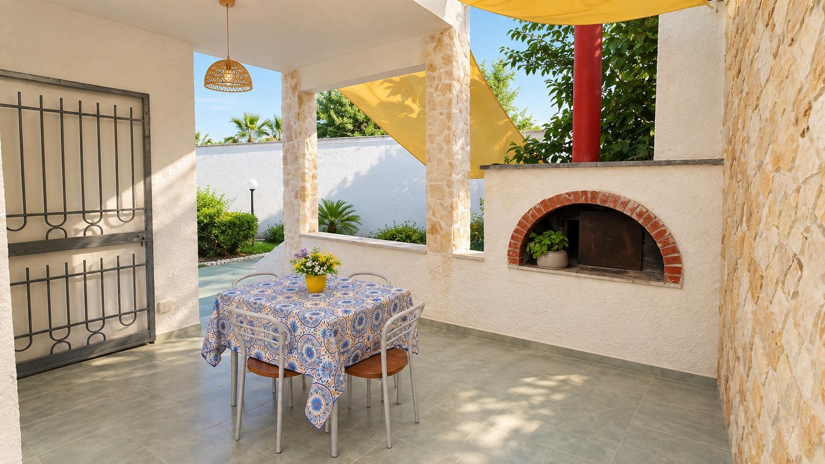 Veranda con forno a legna
