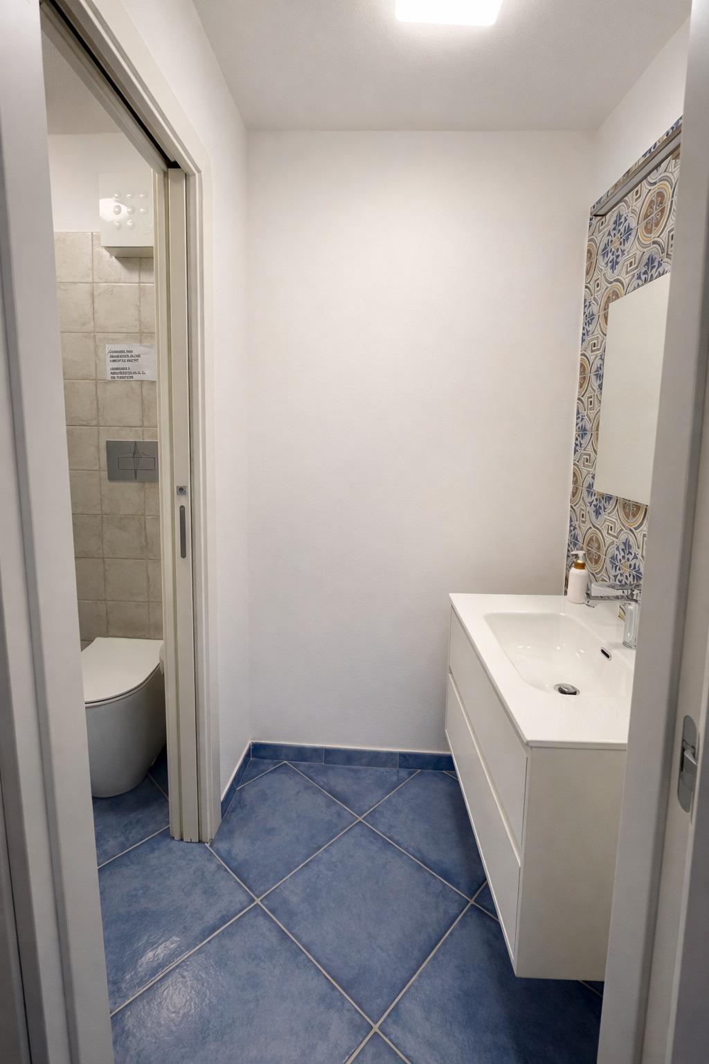 Bagno con dettagli interni curati in stile Oikos Design Sicily